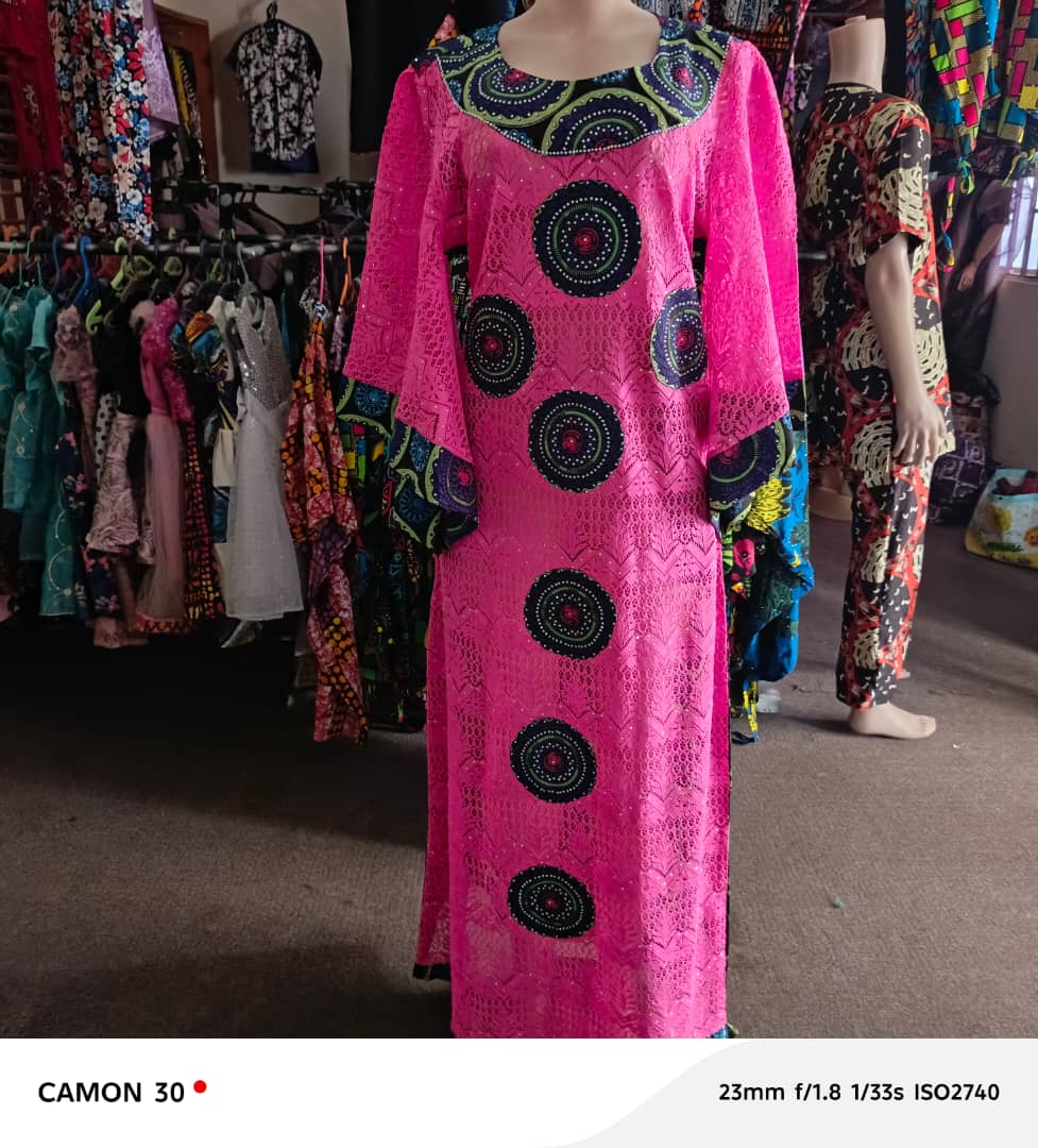 Pink dress displayed in the Devine Gold fashion showroom